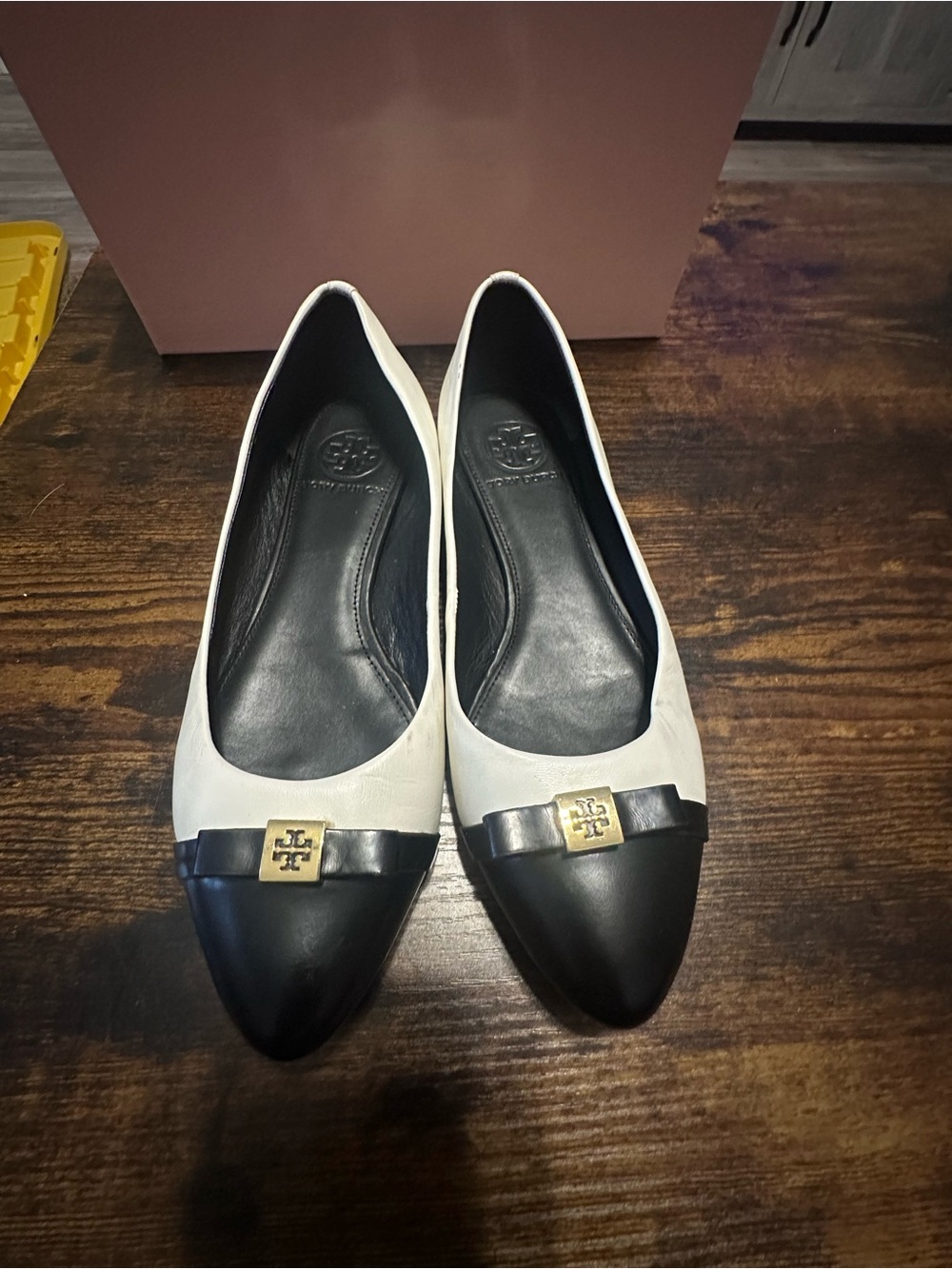 Tory Burch Two-Tone Pointed Toe Flats in White and Black with Gold Logo